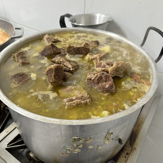 A pot of hot soup prepared for the weekly TIKVA Sala meal