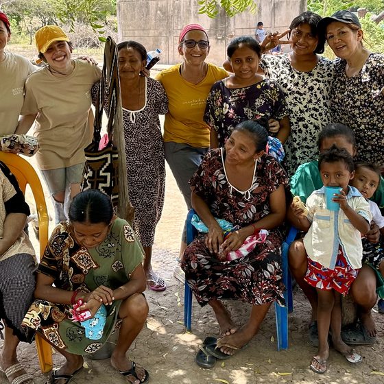 A TIKVA mission team with a family from the community
